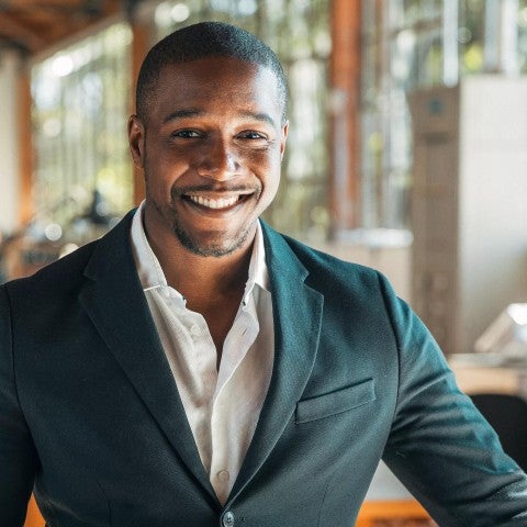 Man smiling that he does business with Principal