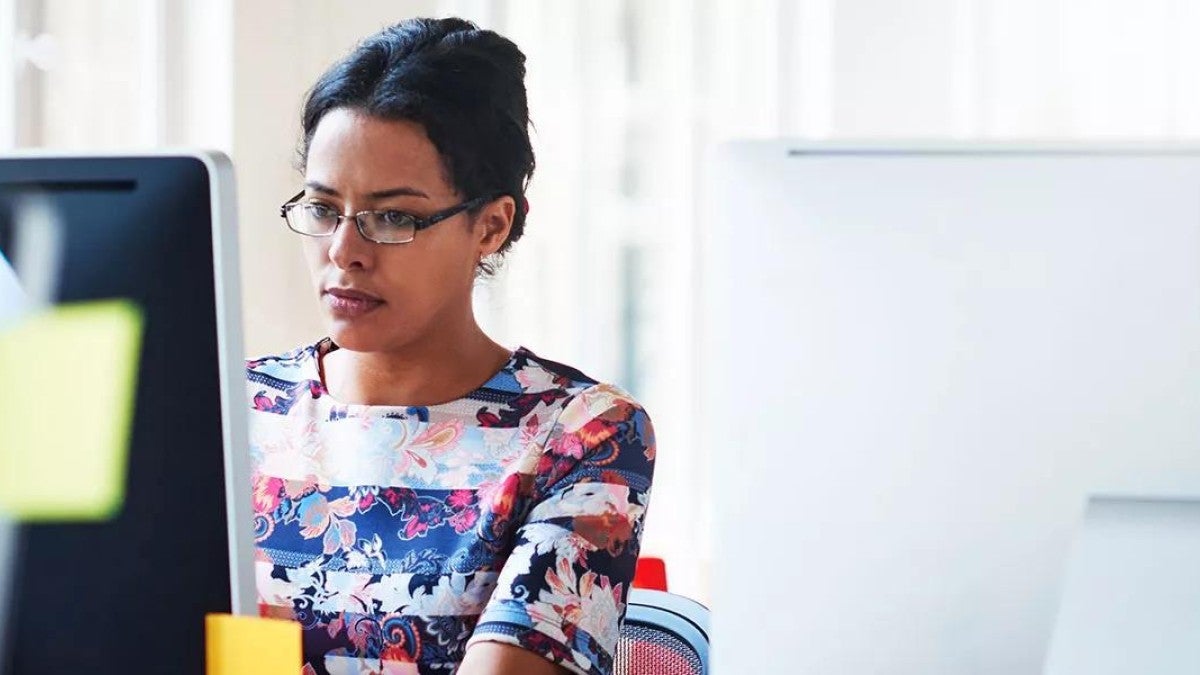 Picture of an employee managing their mental health amid work-related stress.