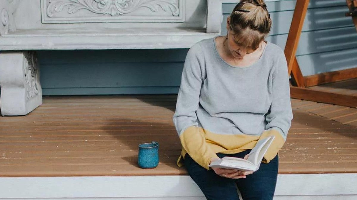 Image of a woman who is getting her finances in order after the death of her spouse.