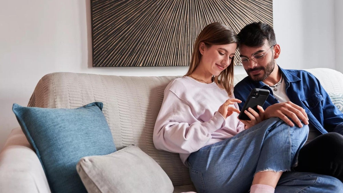 Photo of a couple who is saving on their taxes while also saving for retirement.