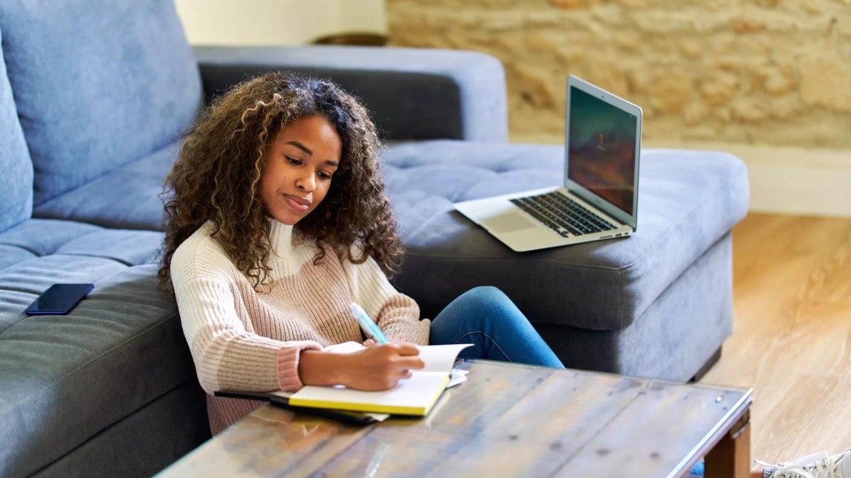 Photo of woman preparing her files for tax season.