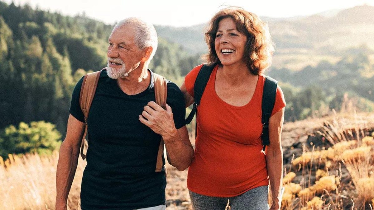 Image of couple hiking in the mountains.