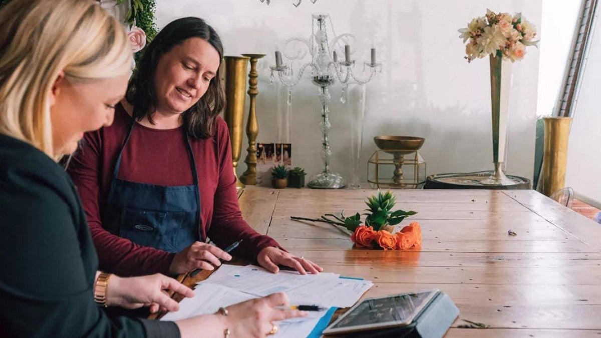 Photo of a woman talking with a financial professional.
