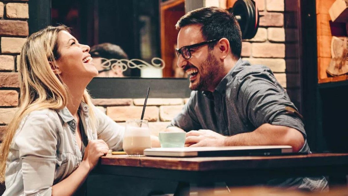 Photo of a couple being fun and responsible with their tax refund.