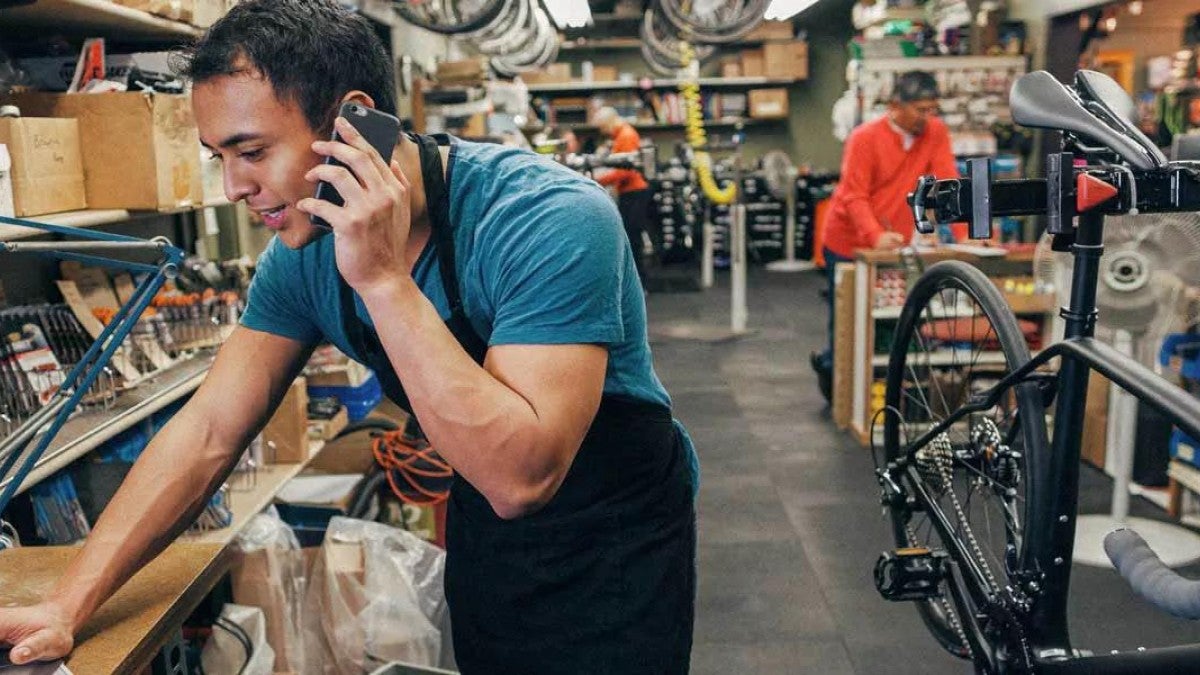 Photo of a business owner working in their store.