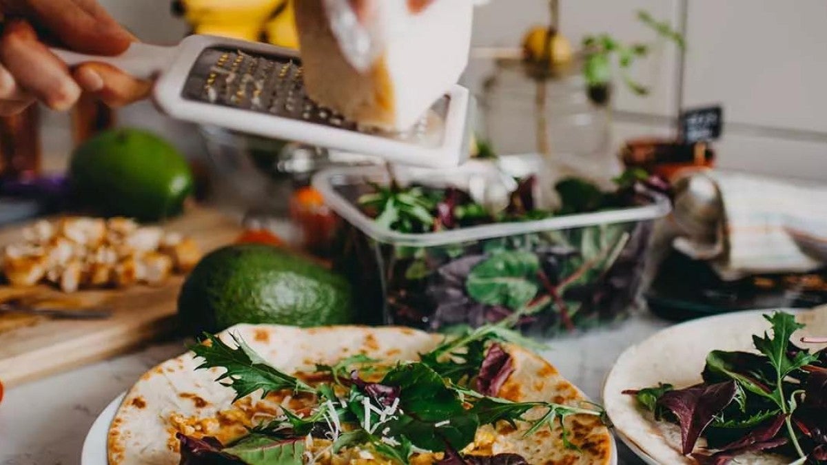 Photo of someone cooking to illustrate that you need to "cook up" a plan for asset allocation.