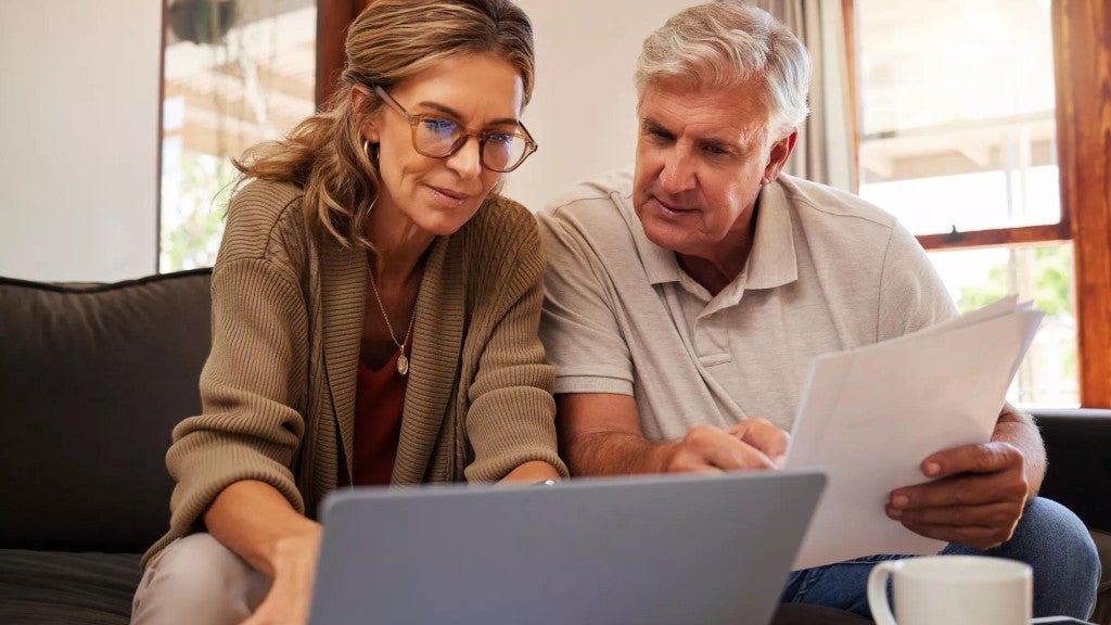 Middle age man and woman discussing retirement savings and mortgage