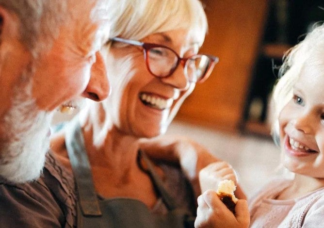 Retired grandparents with their grandchild