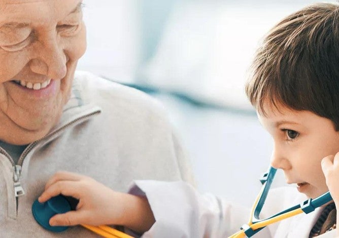 Photo of man enjoying a healthy retirement with grandson.