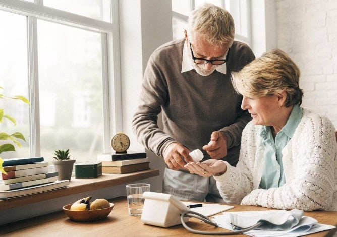 Senior adult taking medicine