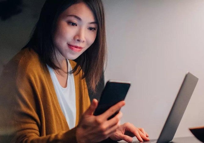 Photo of a woman protecting her online accounts.