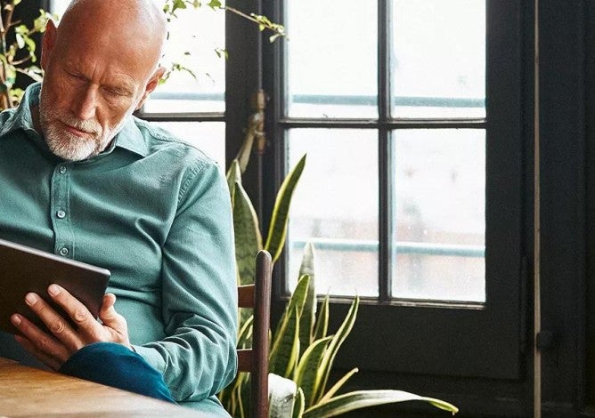 A man browsing on his tablet.