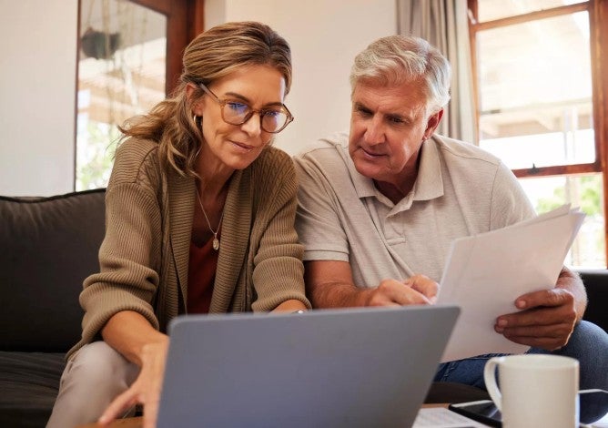 Middle age man and woman discussing retirement savings and mortgage