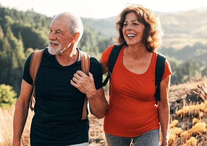 Image of couple hiking in the mountains.