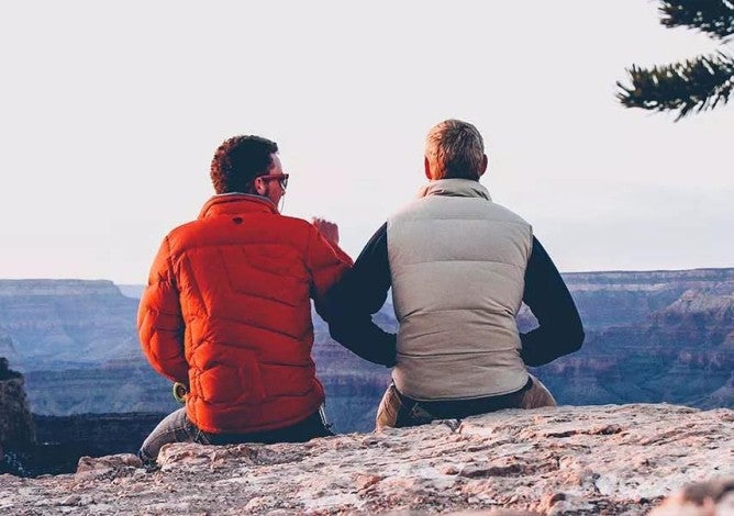 Photo of men who have learned what guaranteed income is and how it can be part of their retirement savings strategy.