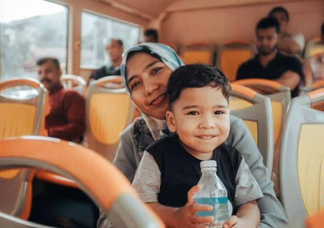 Mother and toddler son in a bus