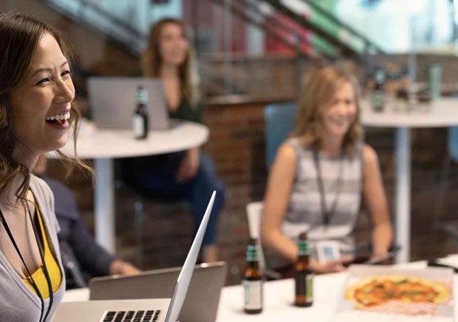 Employees enjoying a lunch meeting