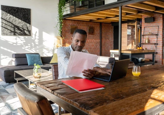 Man working with papers at home.