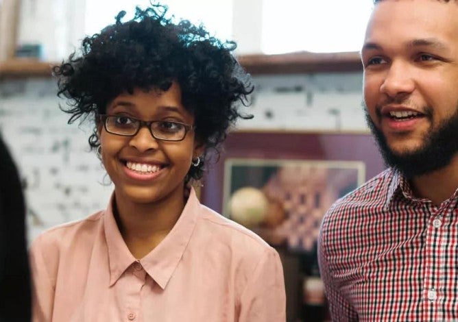 Young couple talking to a financial advisor.