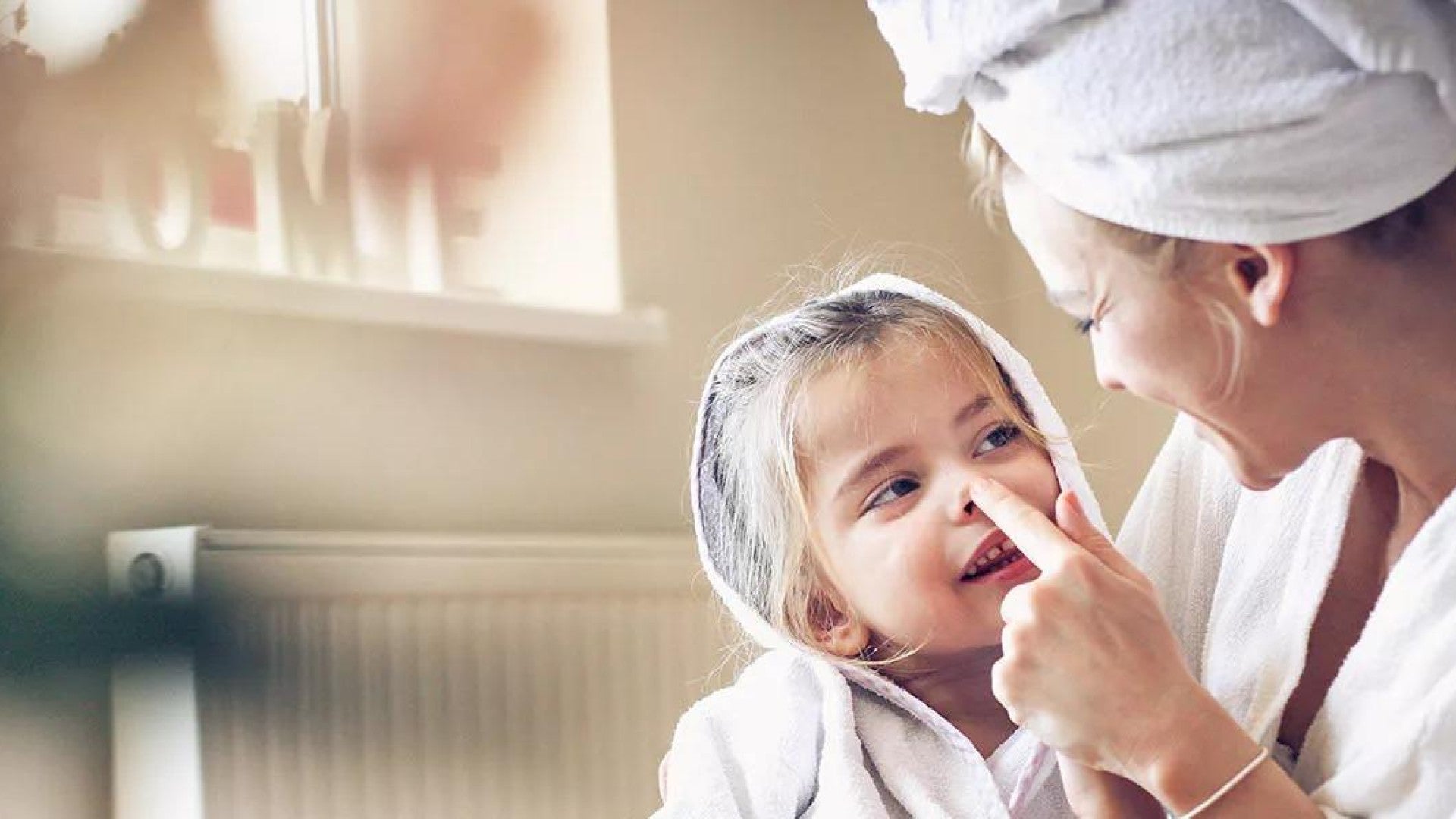 Picture of a woman and a young child after bath time