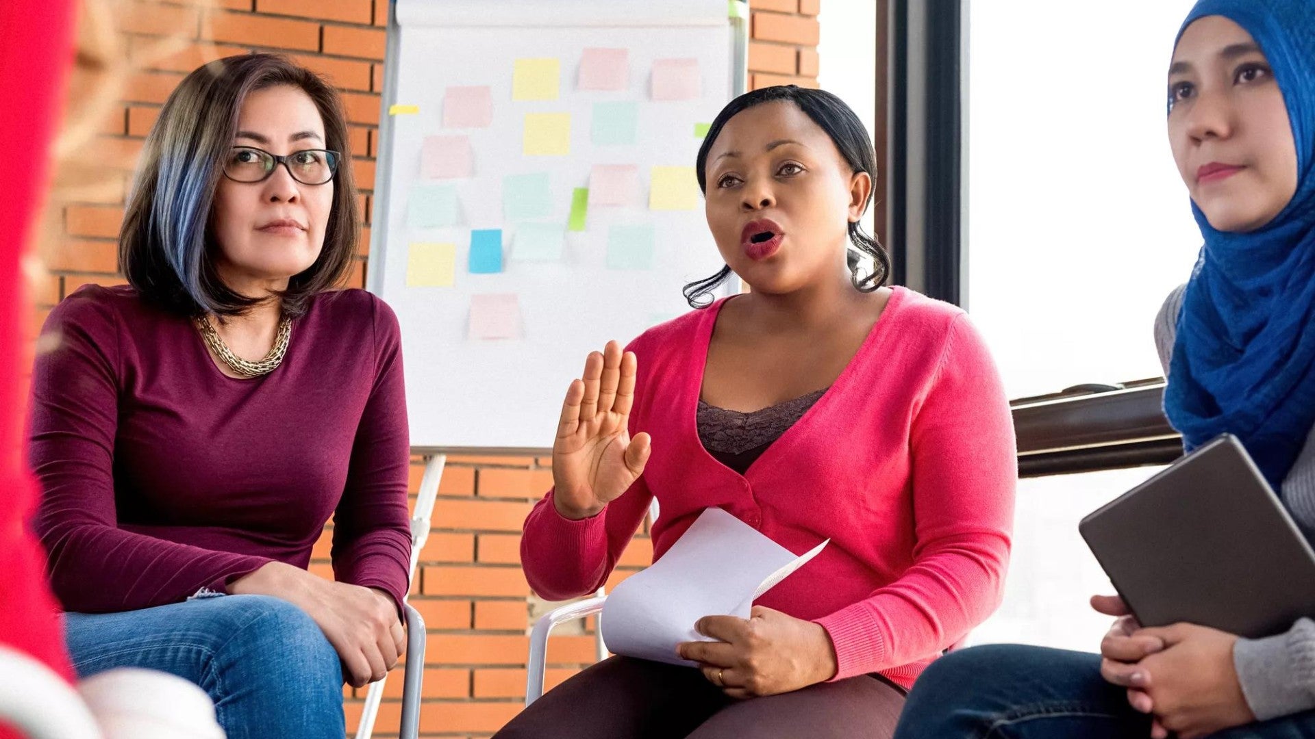 Diverse group of women discussing in a circle