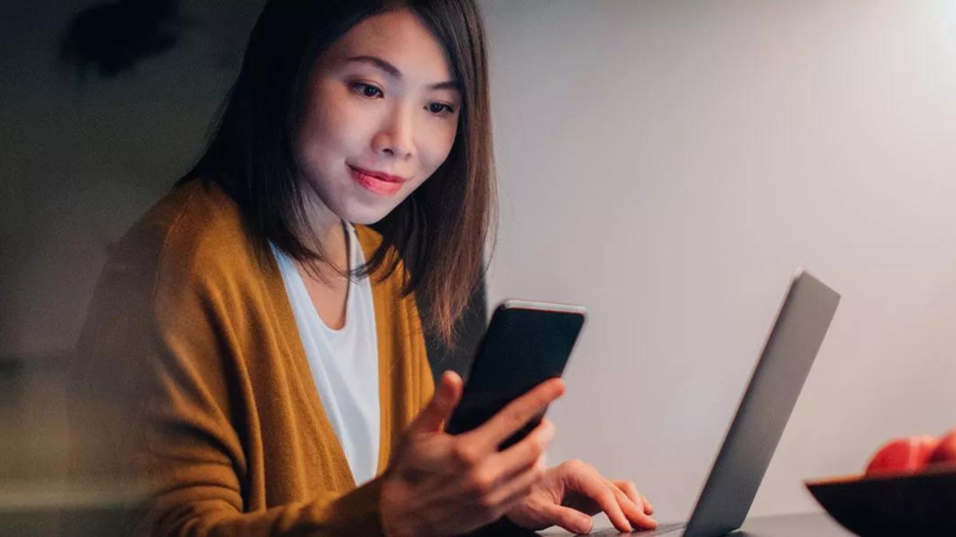 Photo of a woman protecting her online accounts.