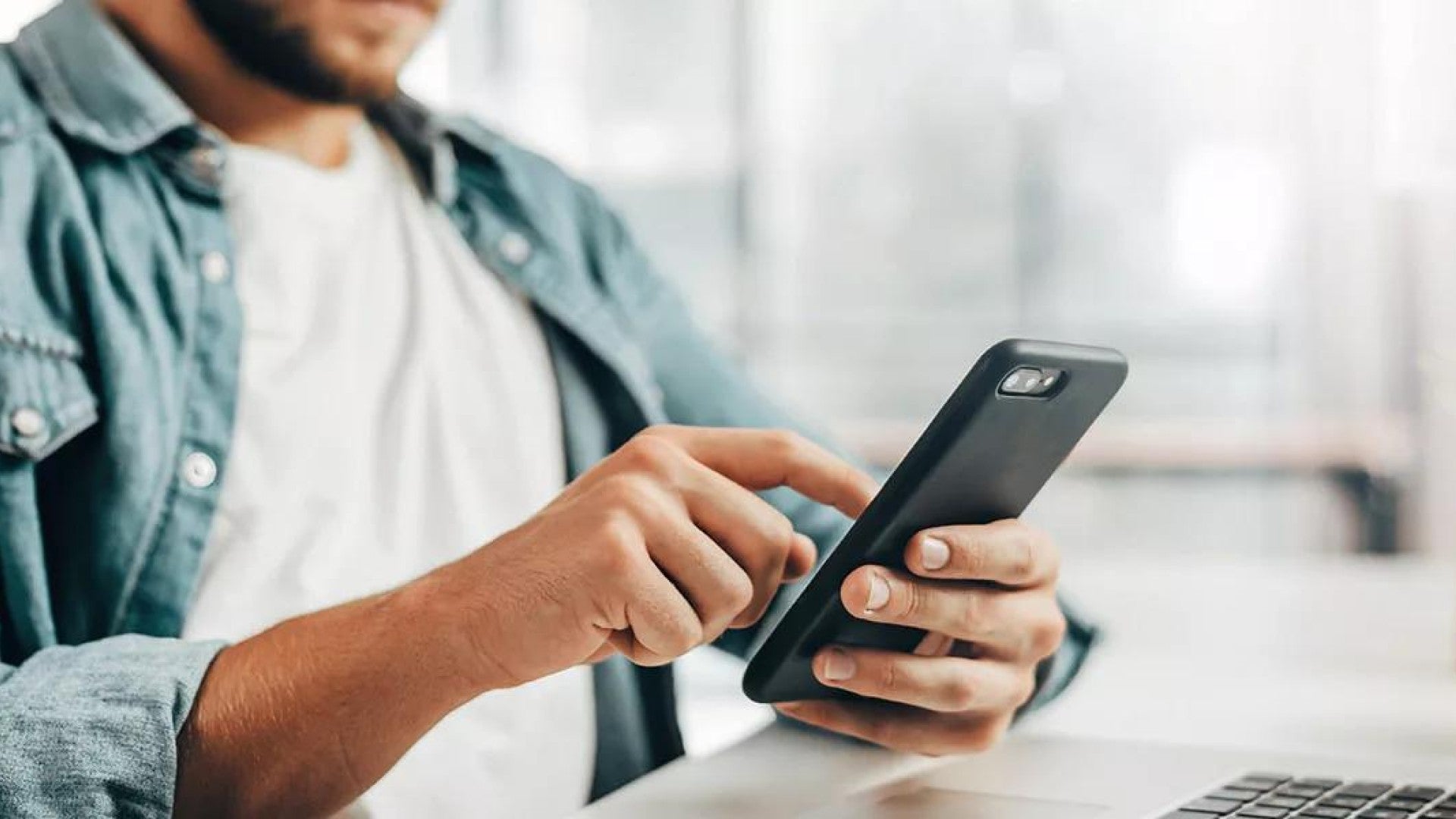 Photo of a man on a cell phone.