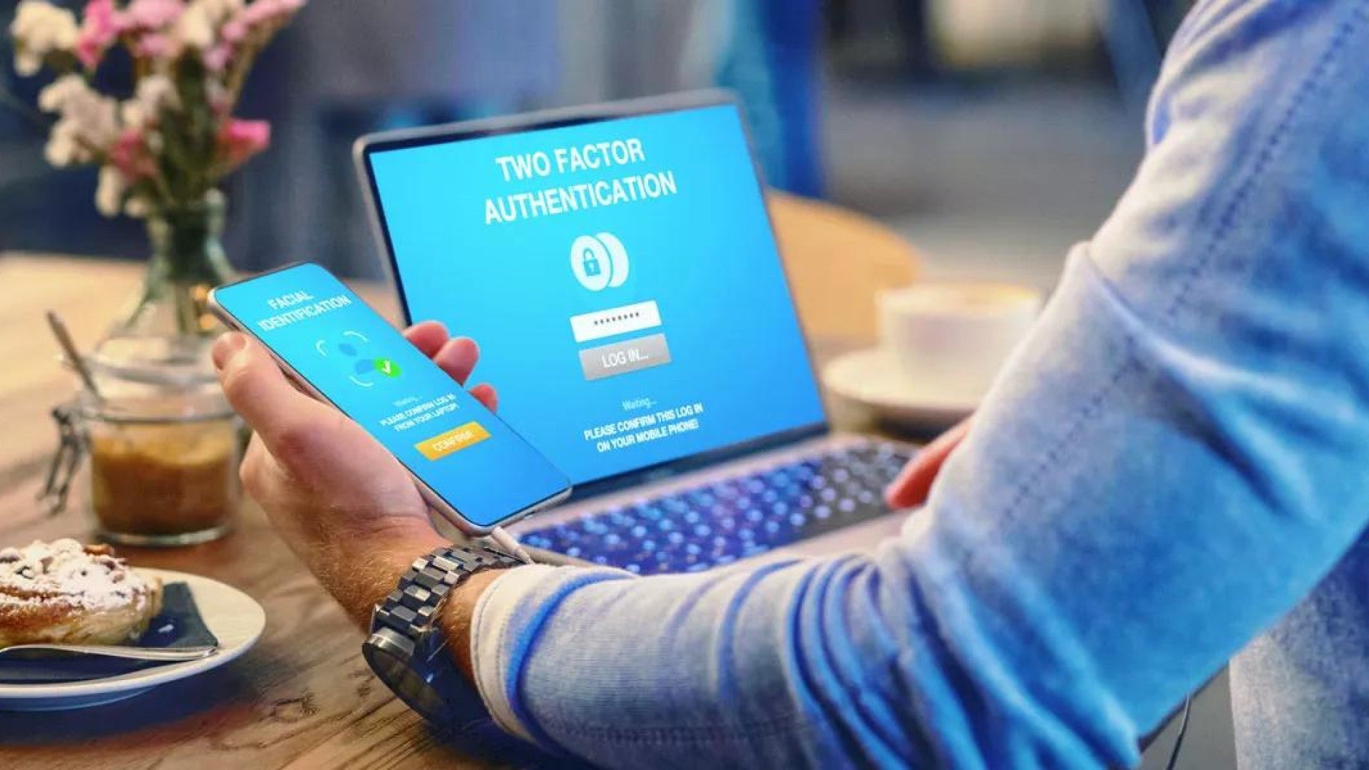 Person logging into a laptop using a two-factor authentication app.