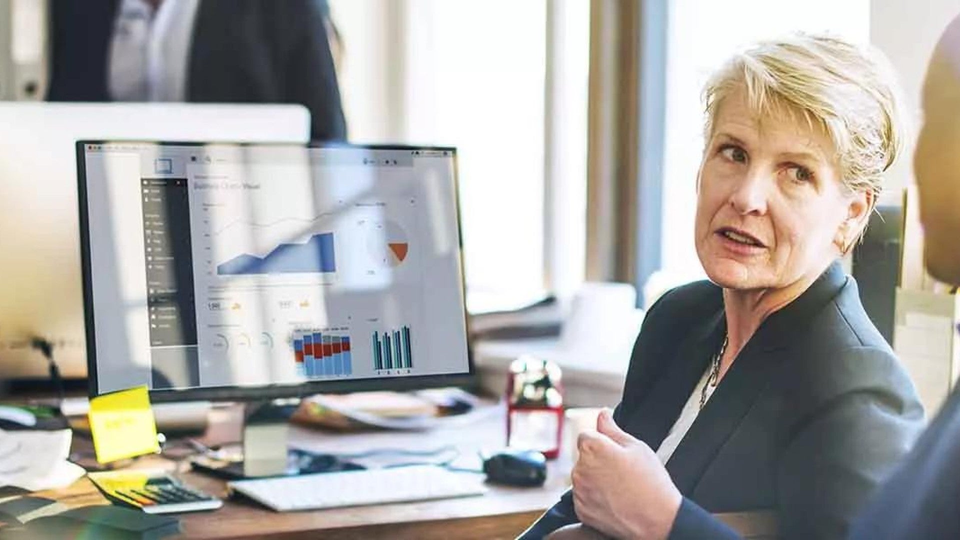 Employer who is discussing her retirement plan fee options.