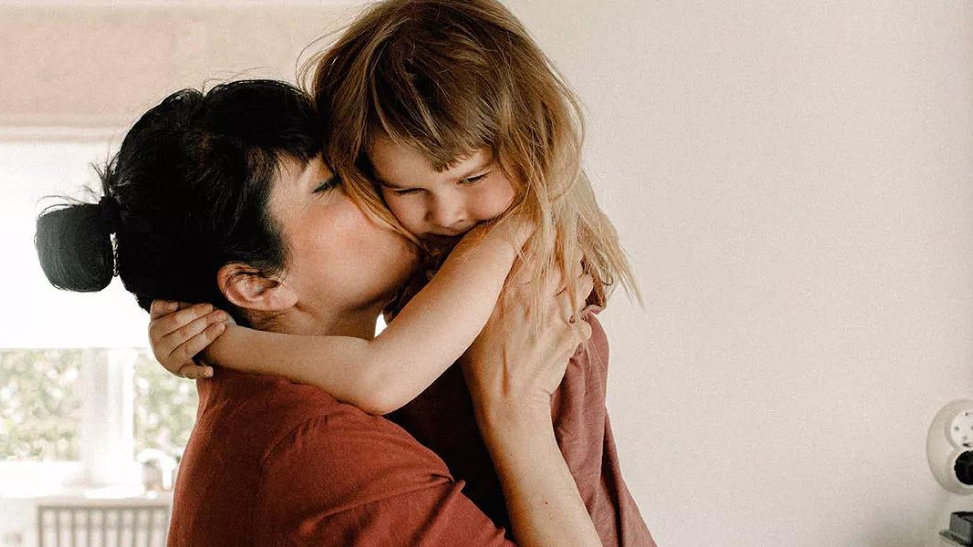 Photo of a woman with a young child.