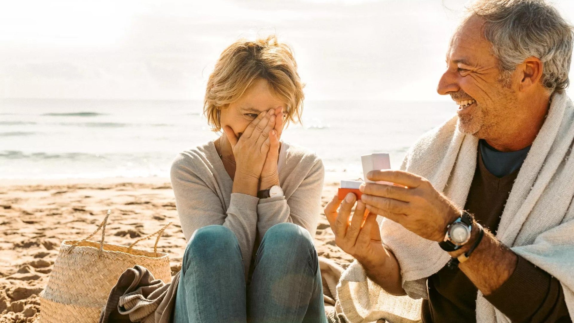 Older couple getting engaged at the beach