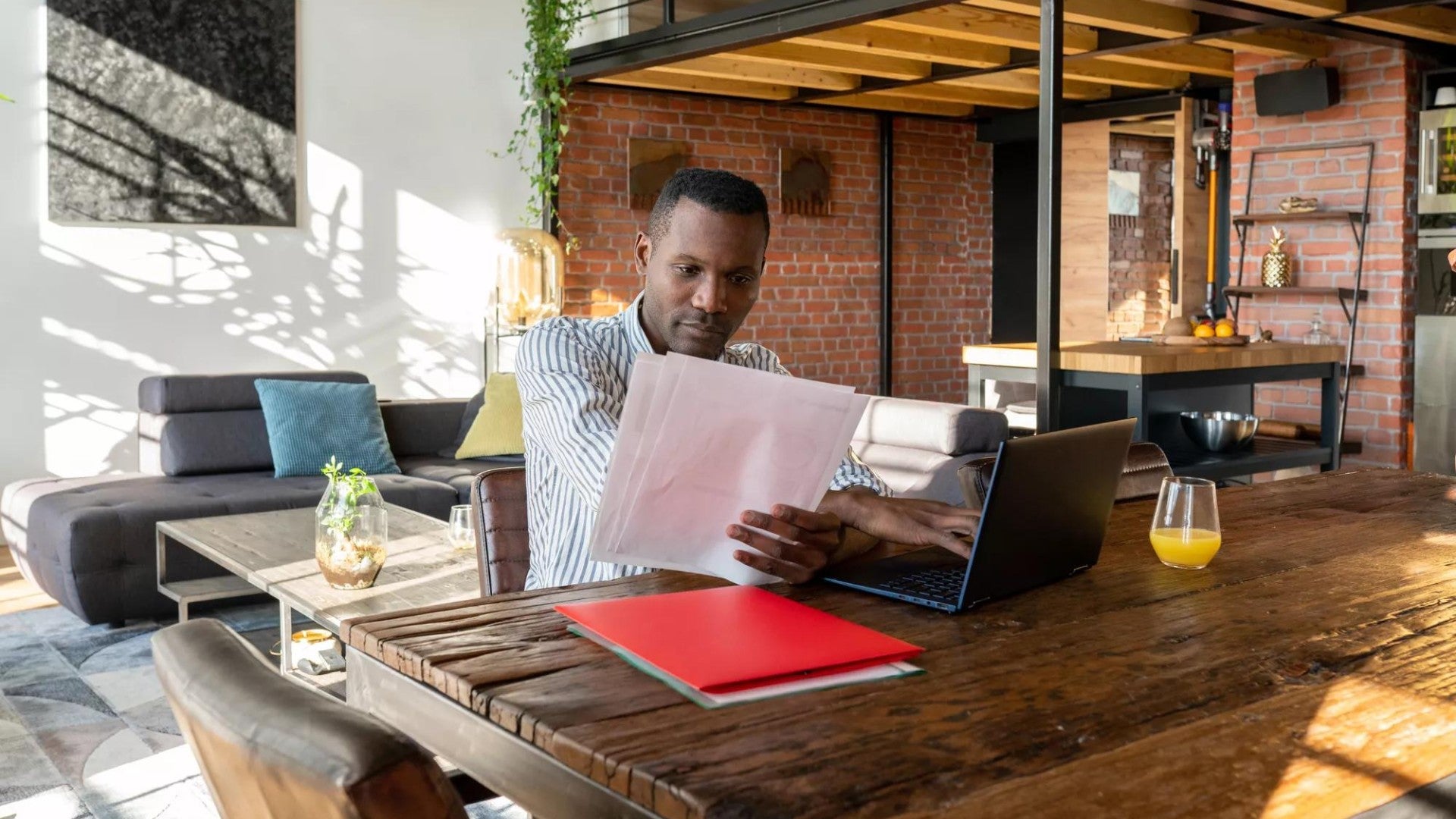 Man working with papers at home.