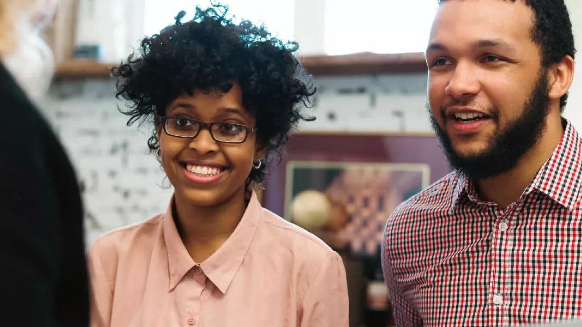 Young couple talking to a financial advisor.