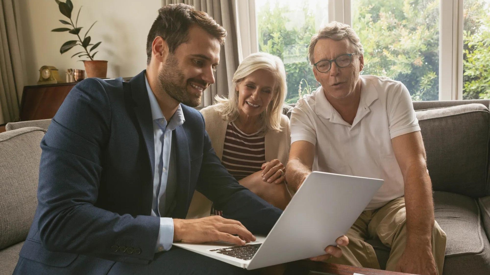 Couple meeting with financial professional to review savings.